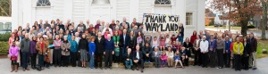The members of First Parish church gathered in front of the 200-year-old meetinghouse to send a warm and  grateful “Thank You” to the citizens of Wayland. At Spring 2014 Town Meeting, voters approved a $150,000  historic preservation grant to restore the meetinghouse and companion carriage sheds. All residents are invited  to an Open House and Carol Sing on December 7 at 4:30 p.m. Please come inside meetinghouse, drink hot chocolate and enjoy fellowship with the community.